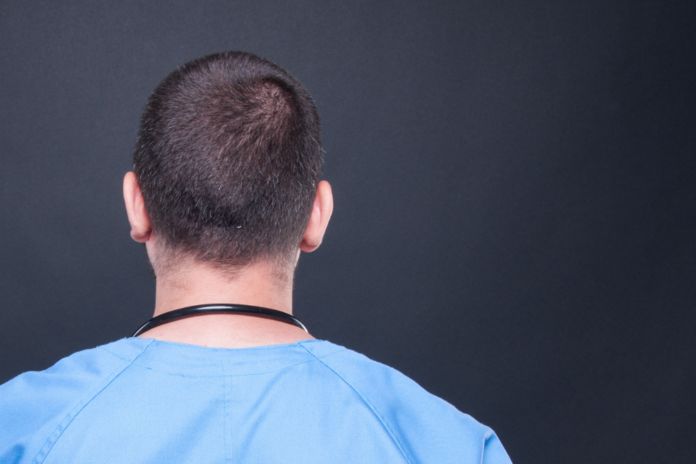 Masks hanging on a clothes line.
