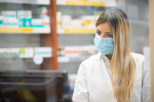 Masks hanging on a clothes line.